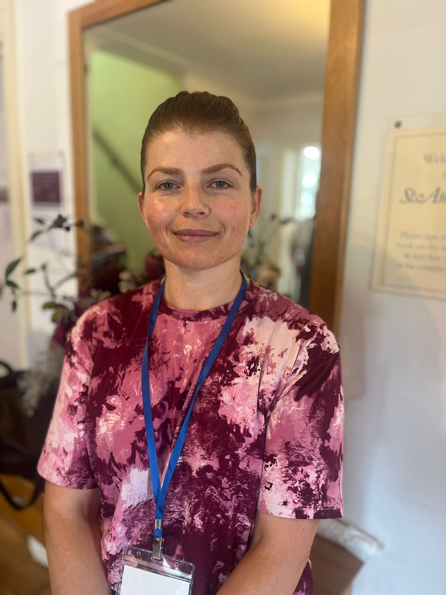 Staff member in a colorful shirt inside the facility