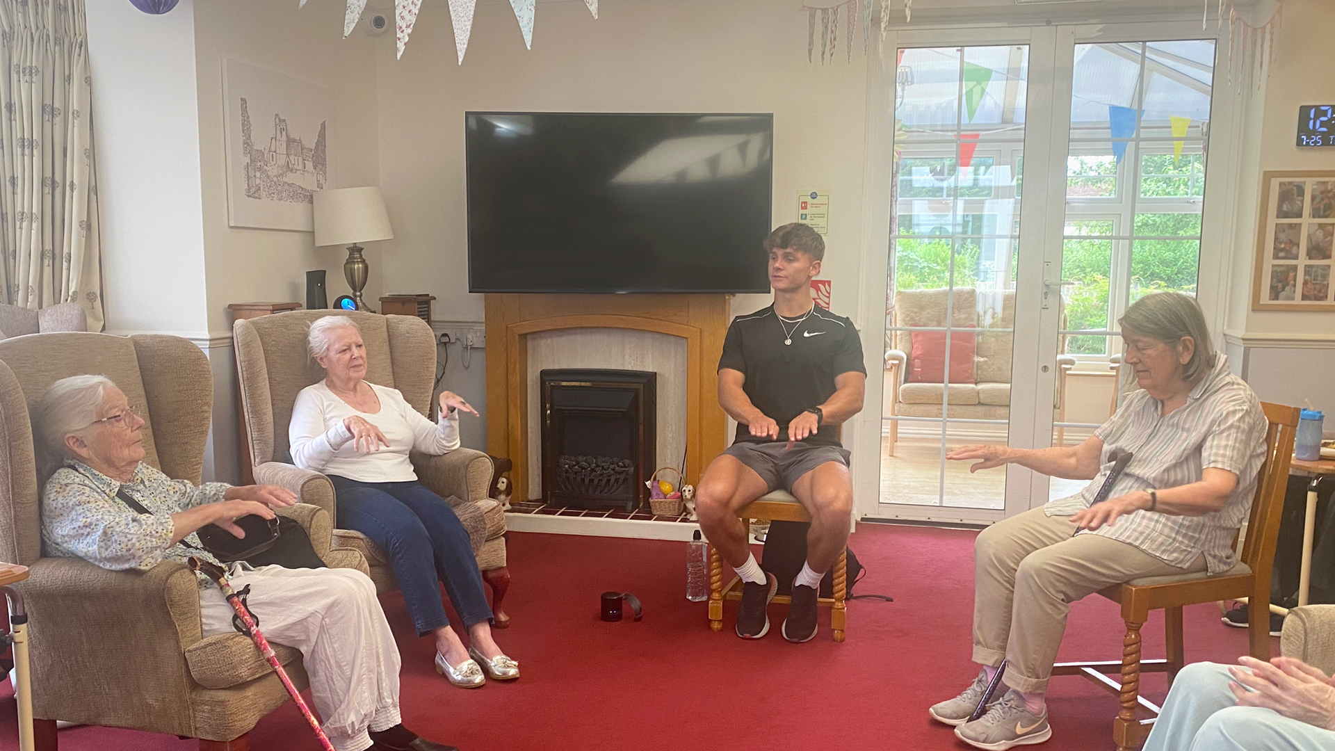 Residents participating in a group activity in a common area