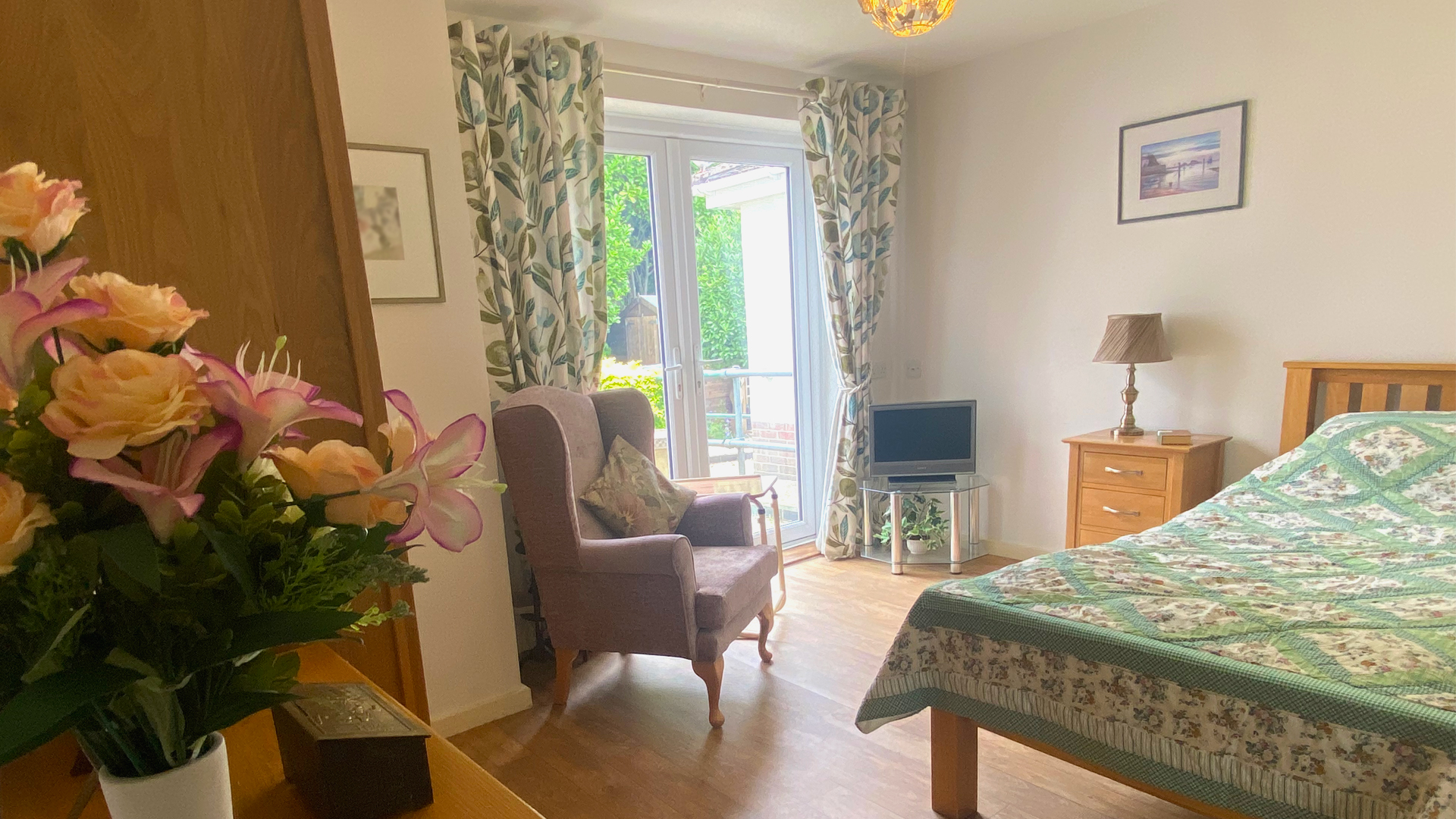 Cozy resident room with flowers and natural light