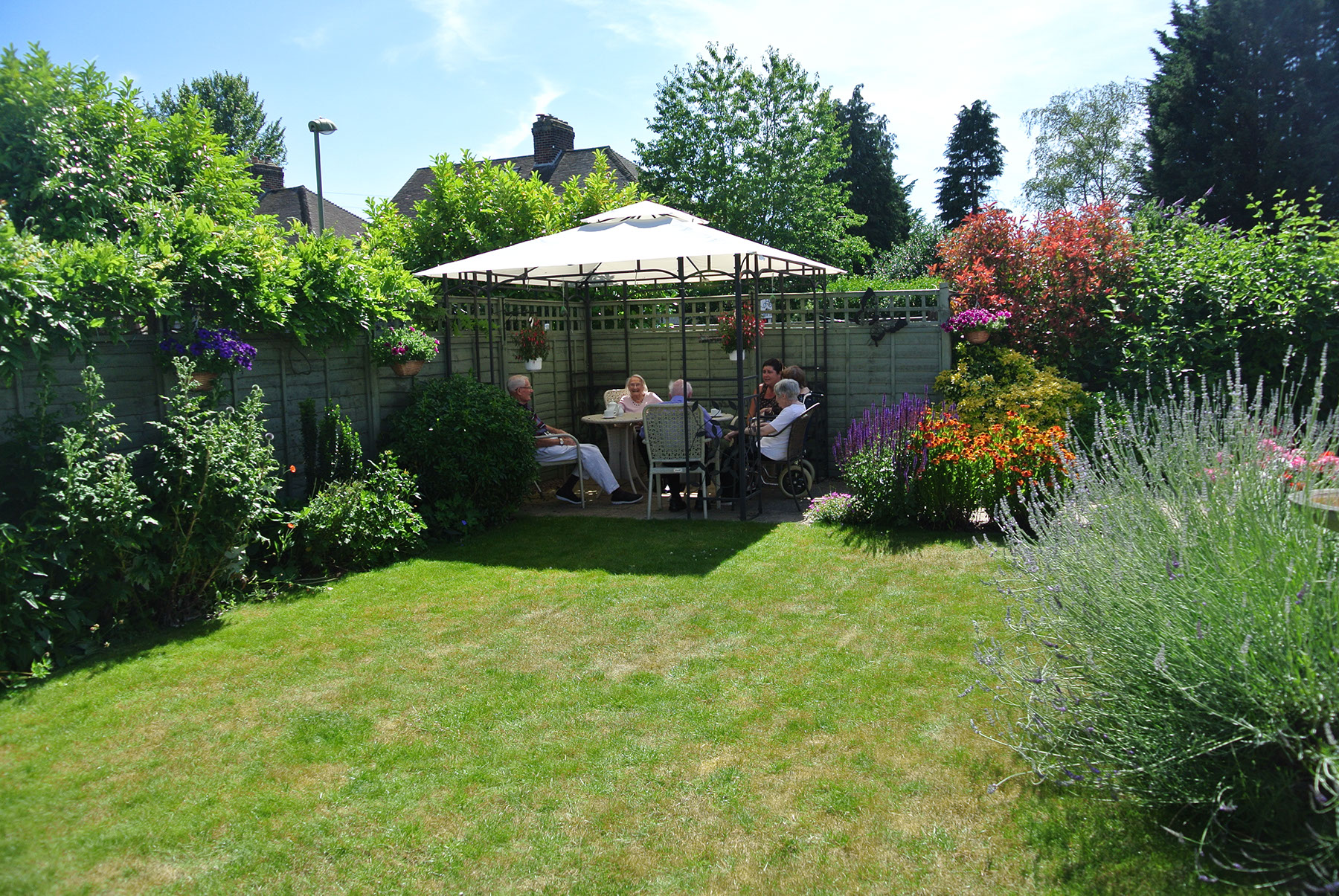 Residents enjoying a sunny day in the garden