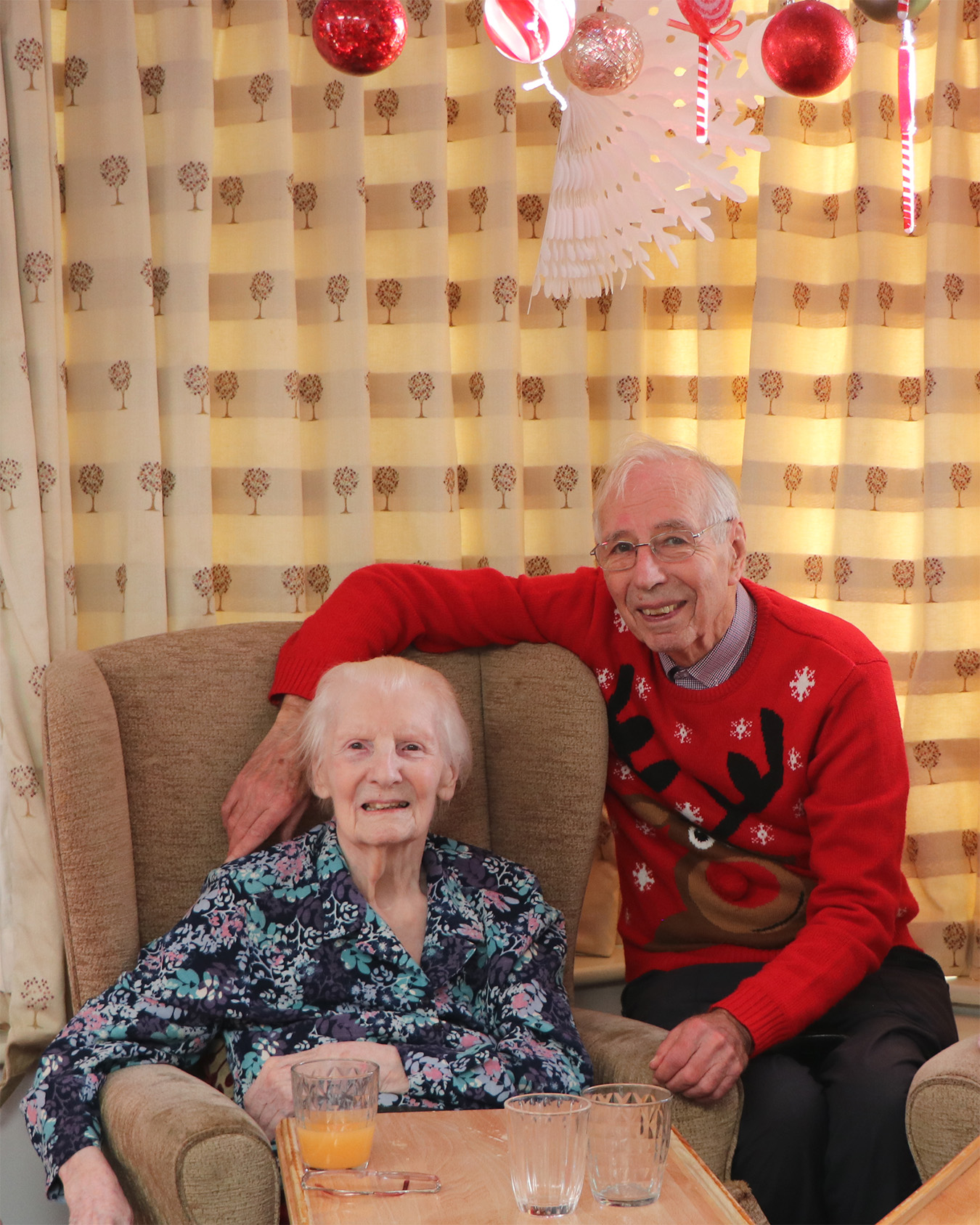 Senior couple sitting together in a cozy room