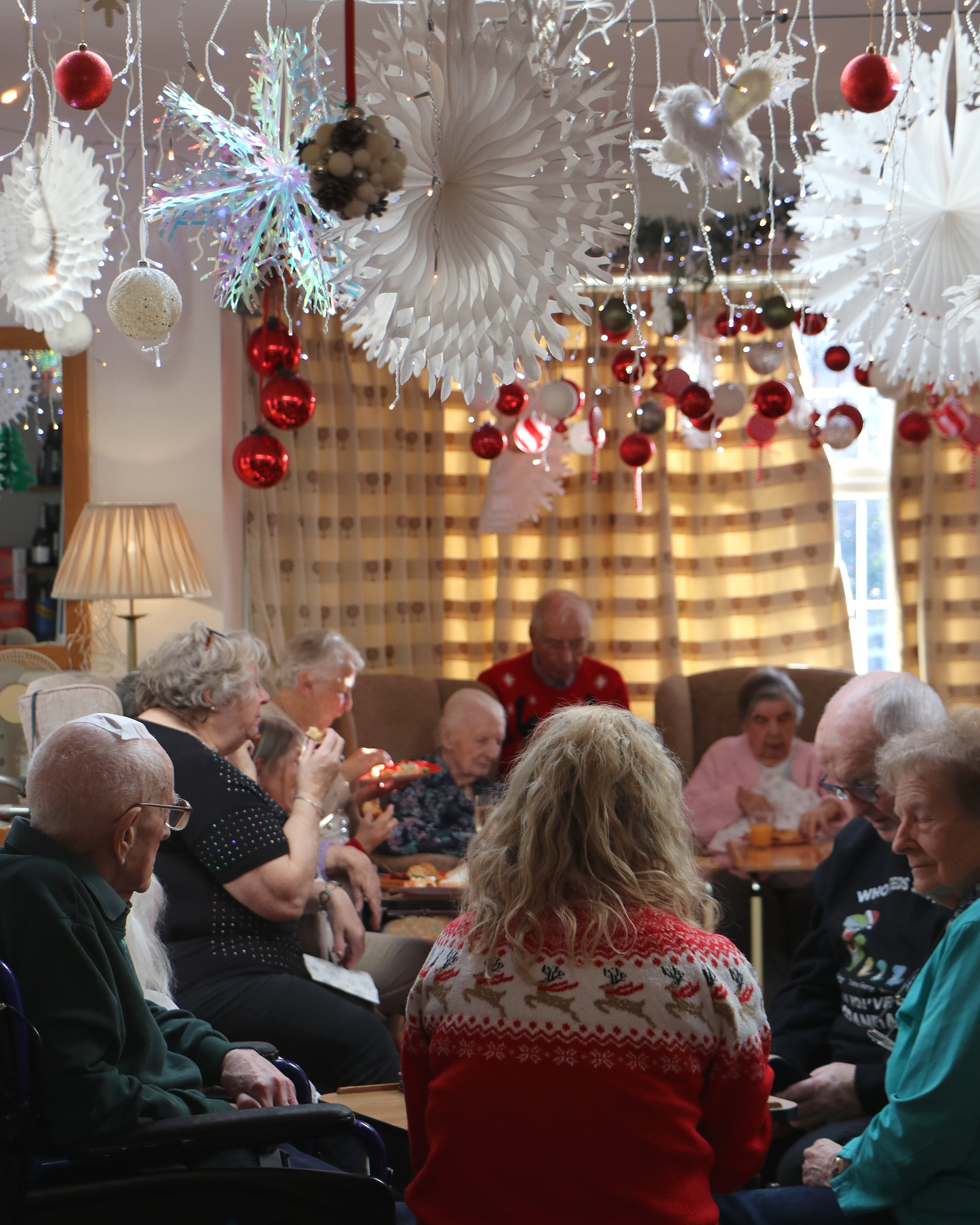 Residents enjoying a festive gathering in a common area