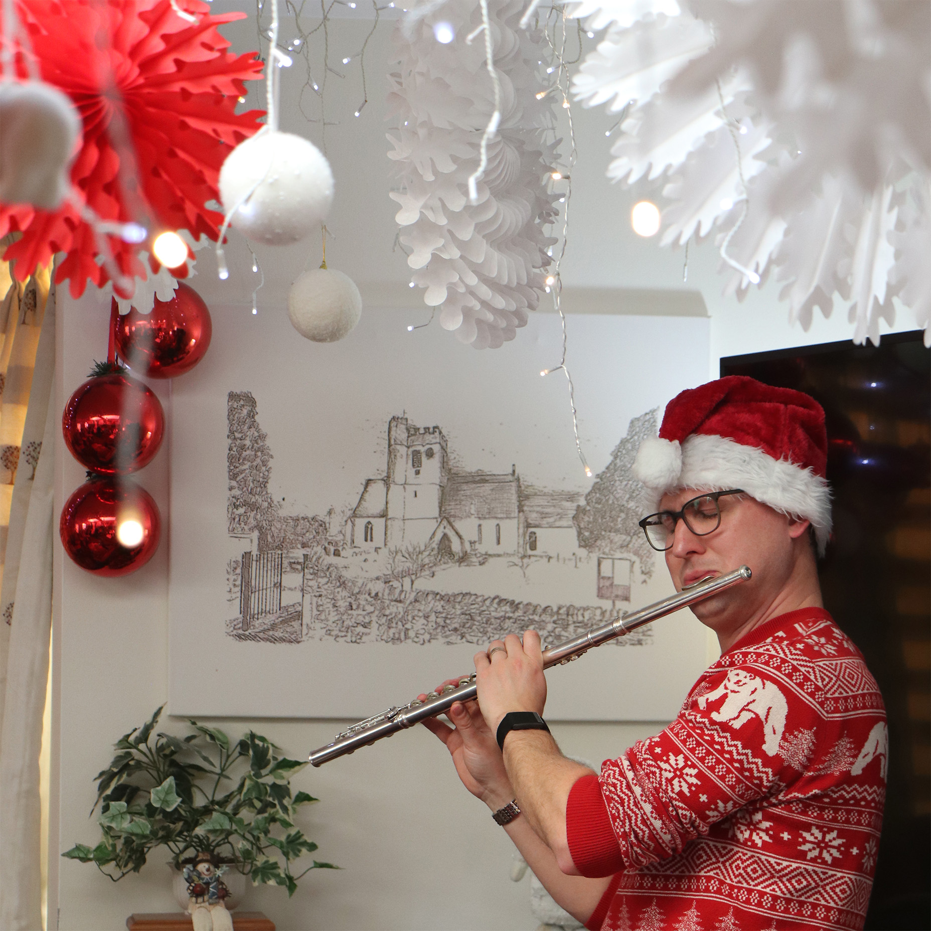 Resident playing flute in a decorated indoor space