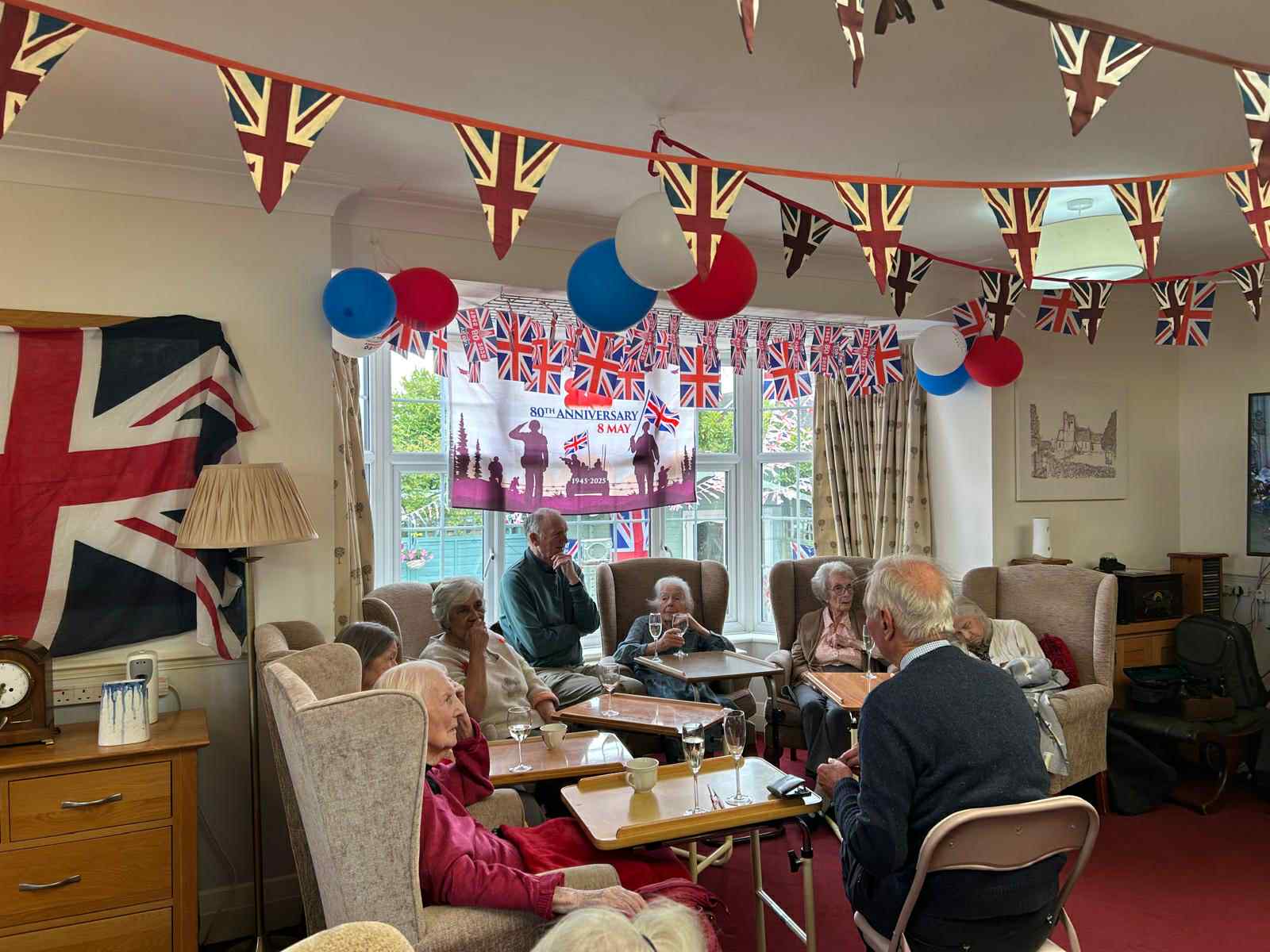 Residents enjoying a social gathering in a decorated common area