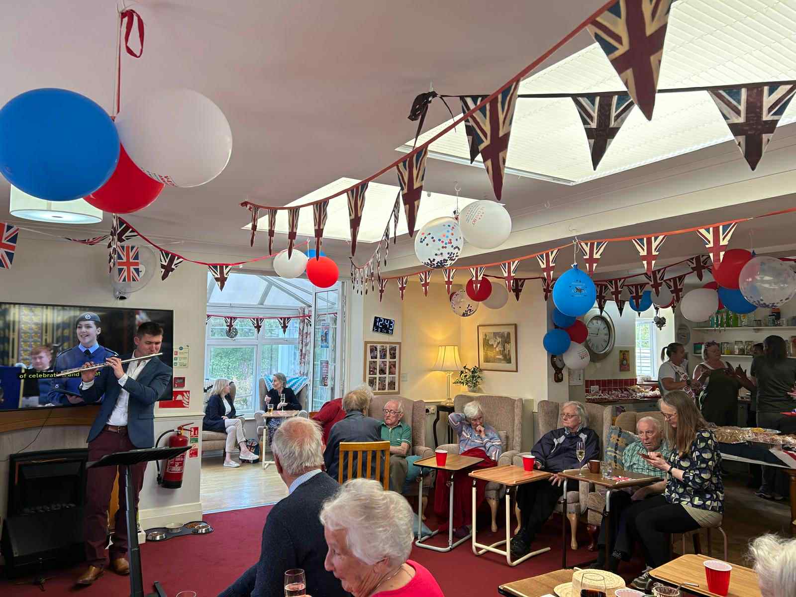 Residents enjoying a celebration in a common area