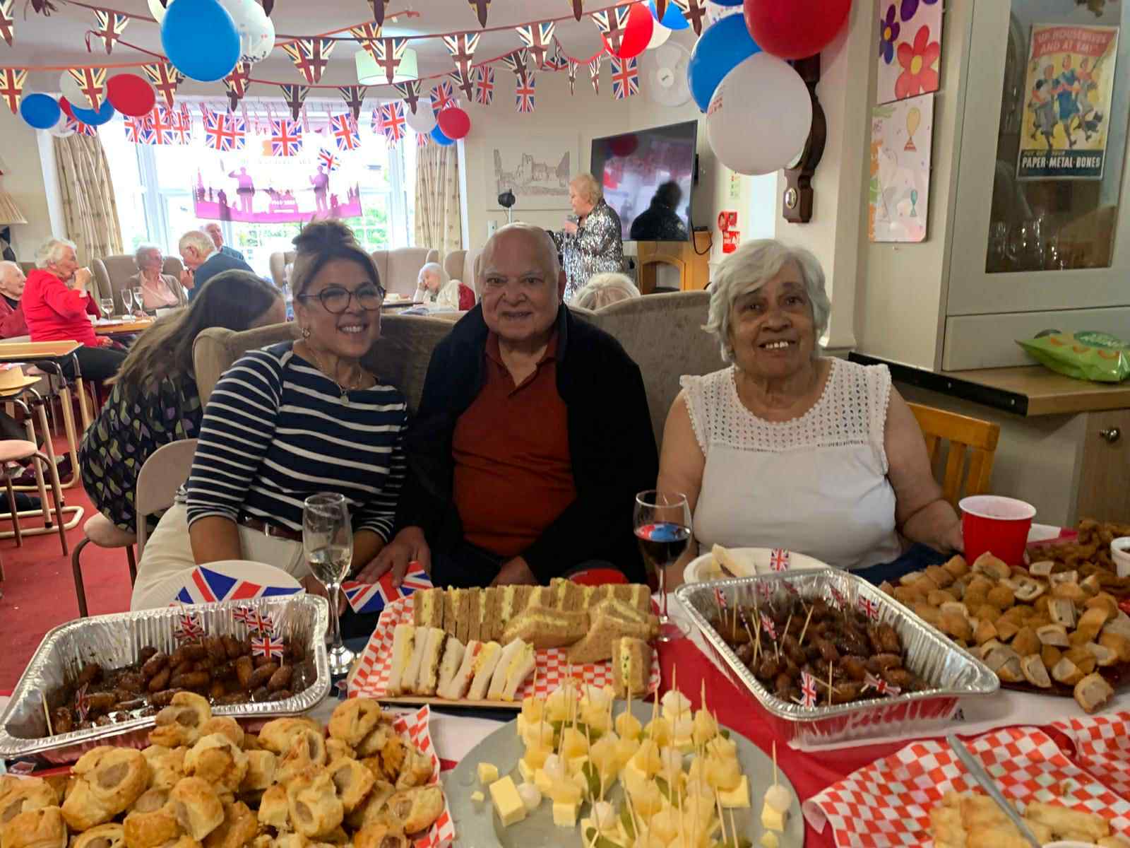 Residents enjoying a celebration with food and decorations