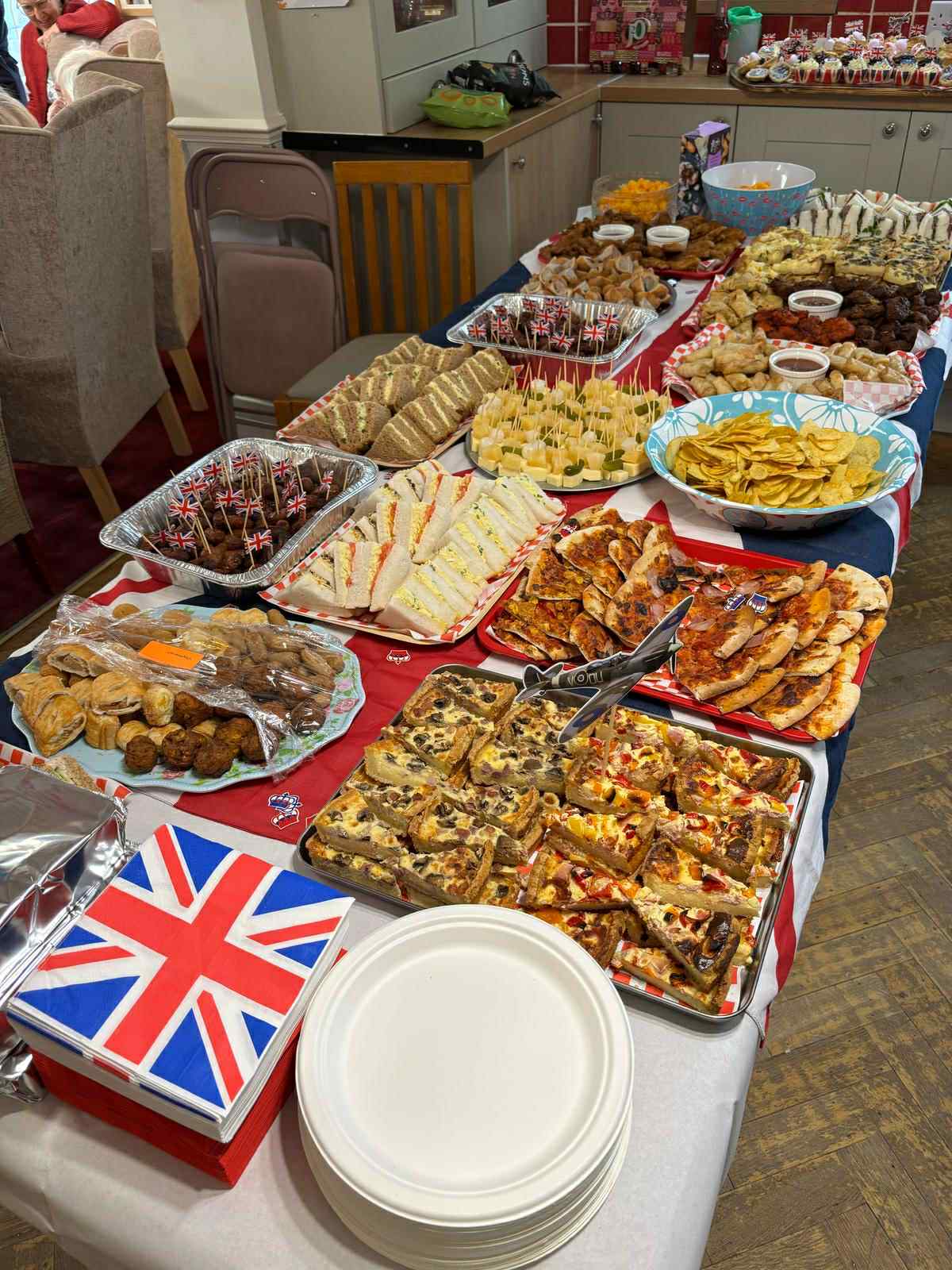 Table full of various food items for a gathering