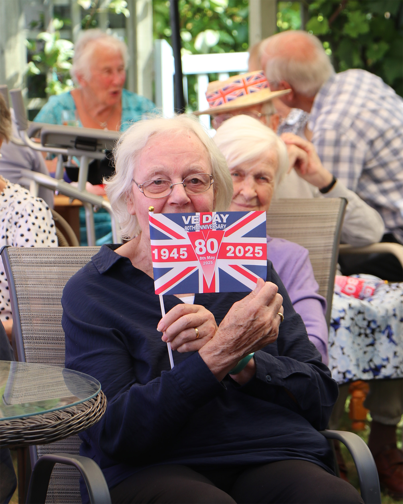 Residents celebrating VE Day with flags