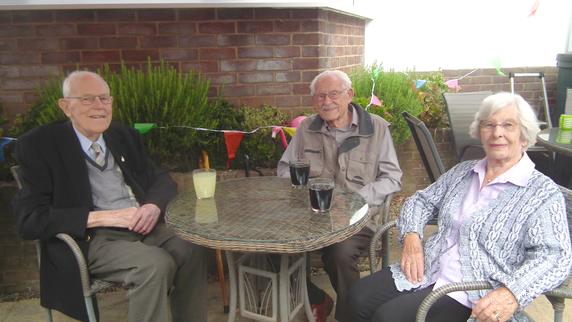 Residents enjoying refreshments outdoors