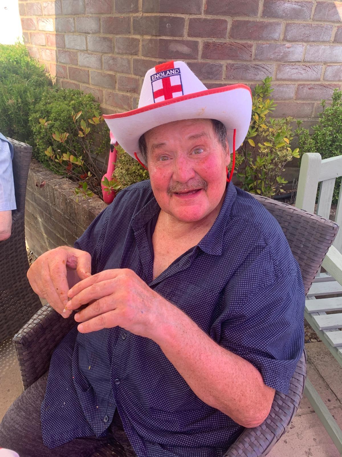 Resident enjoying time outdoors with a festive hat