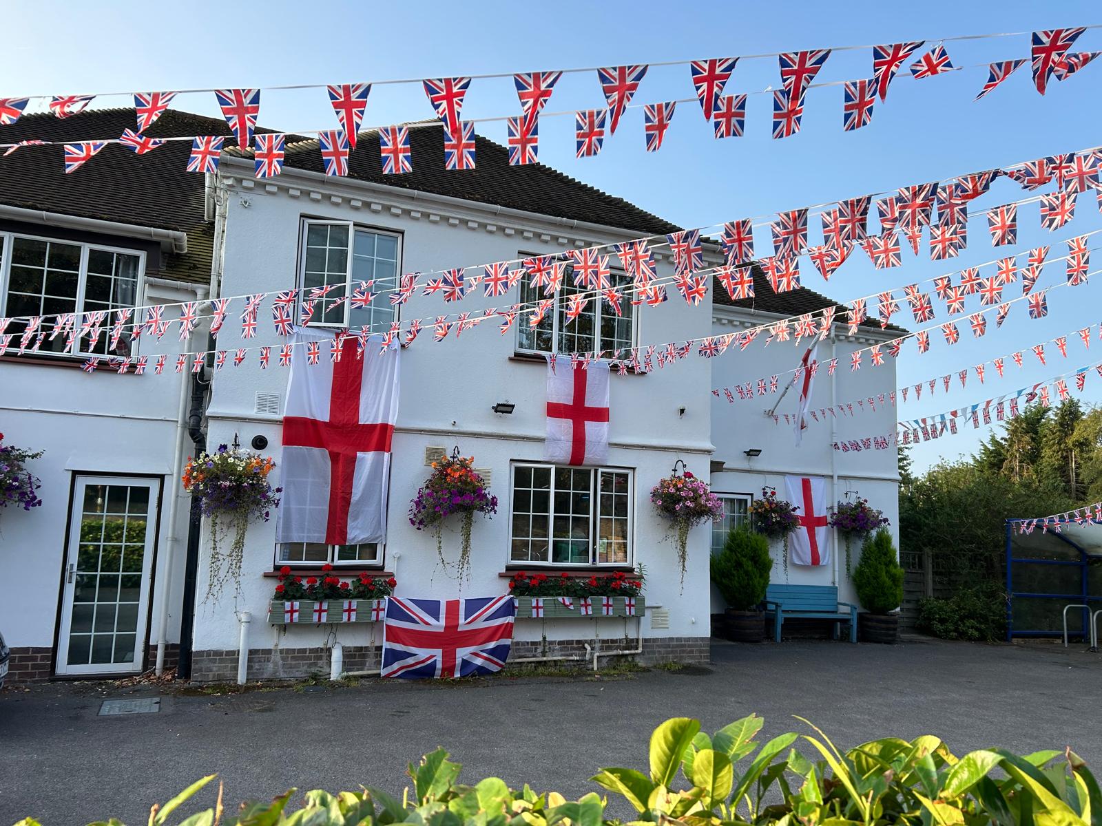 Exterior view of the facility decorated with flags