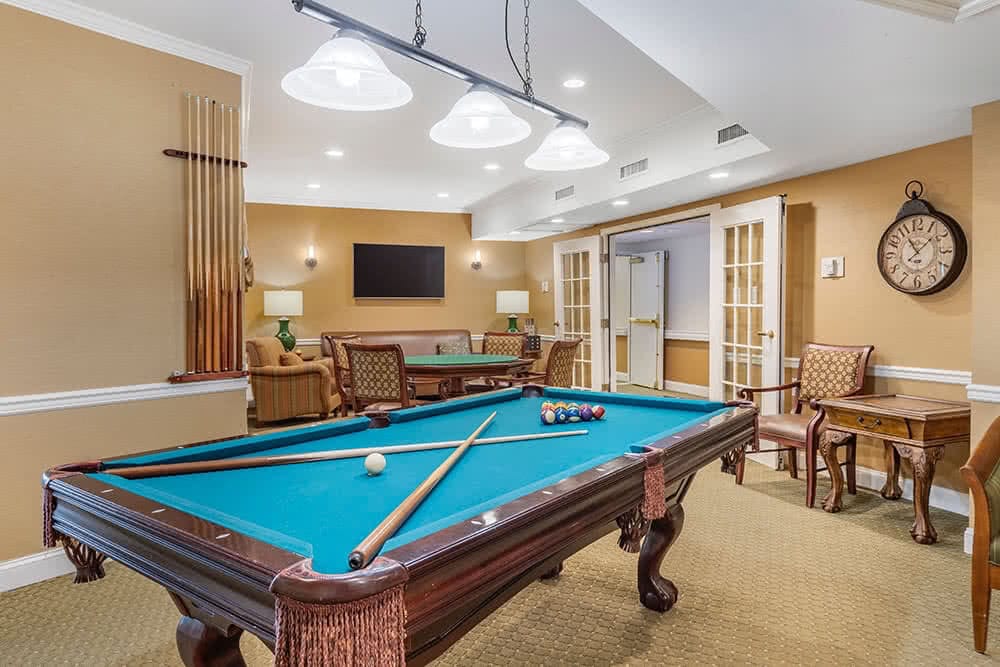 Interior view of a game room with a pool table