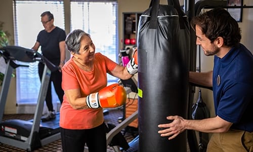 Residents engaging in fitness activities with trainers