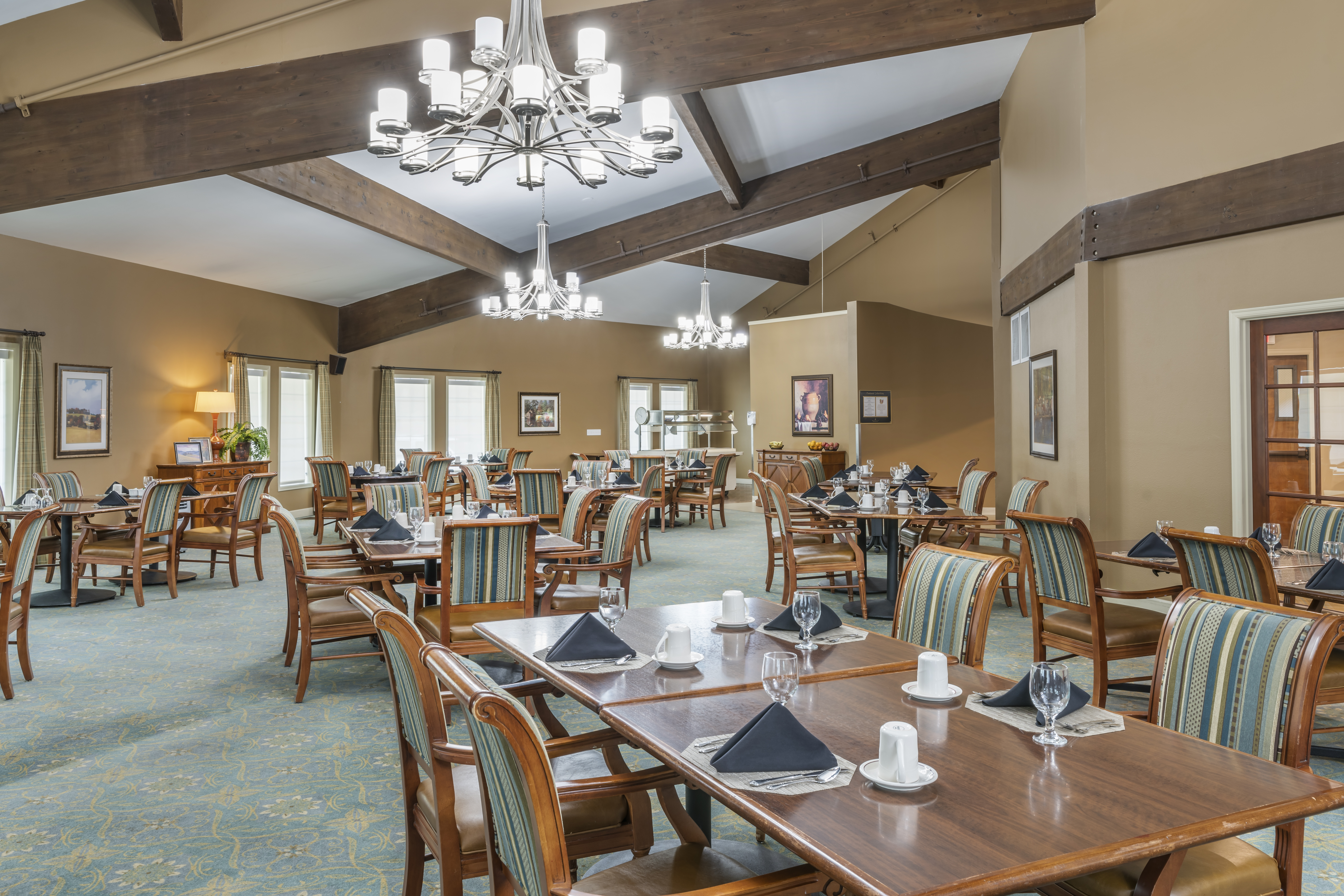 Bright dining room with tables set for meals