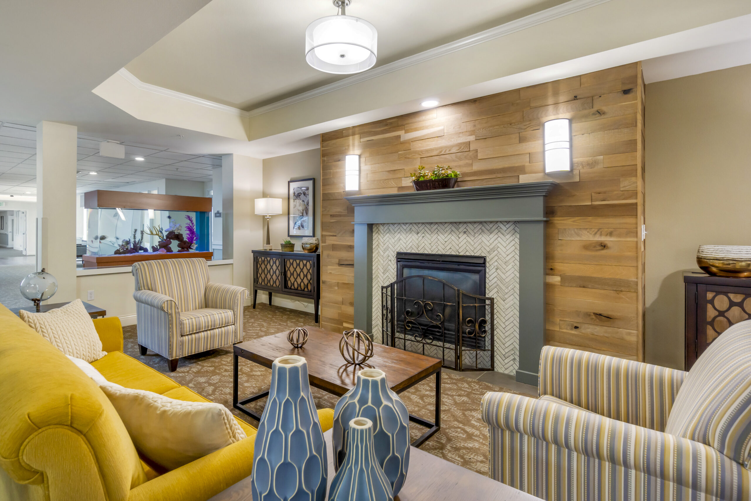 Cozy common area with comfortable seating and a fireplace