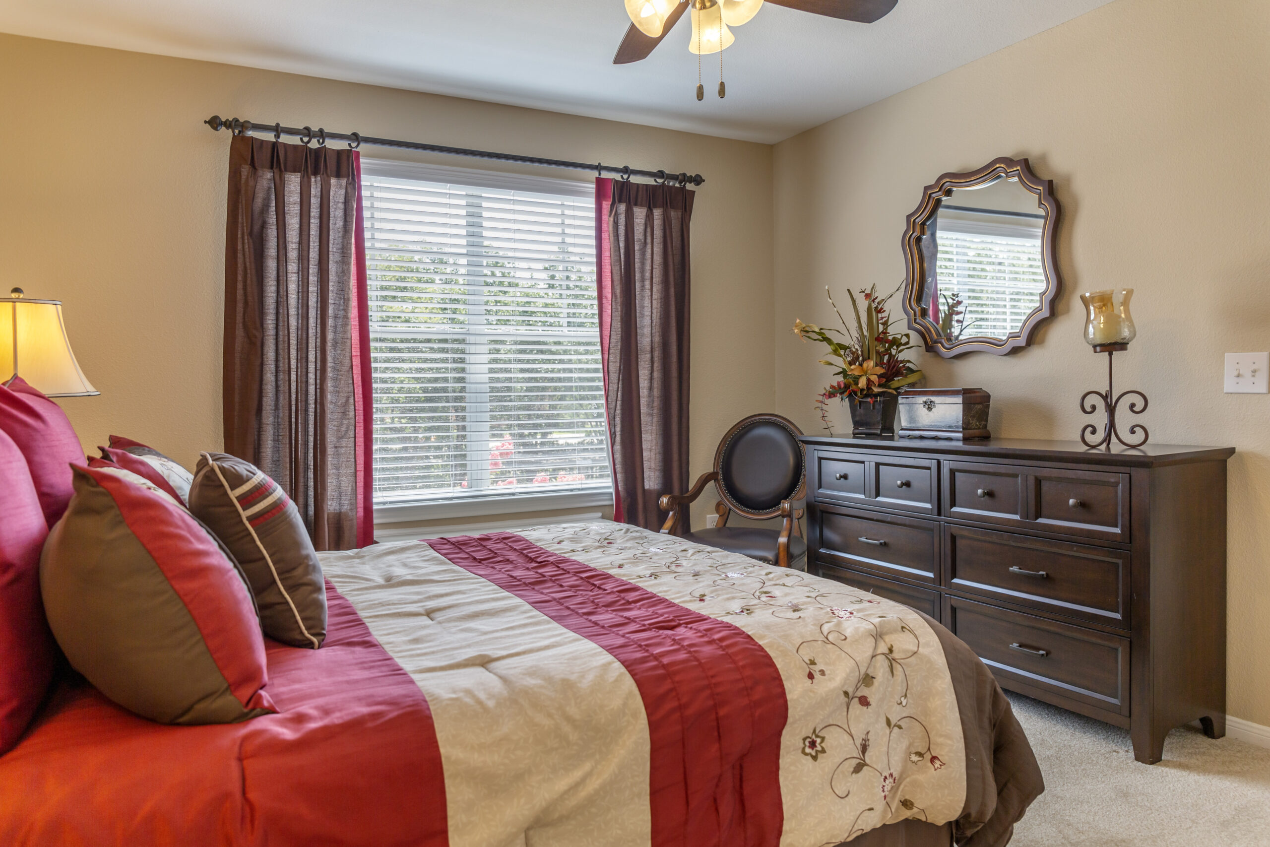 Cozy interior of a resident room with bed and furniture