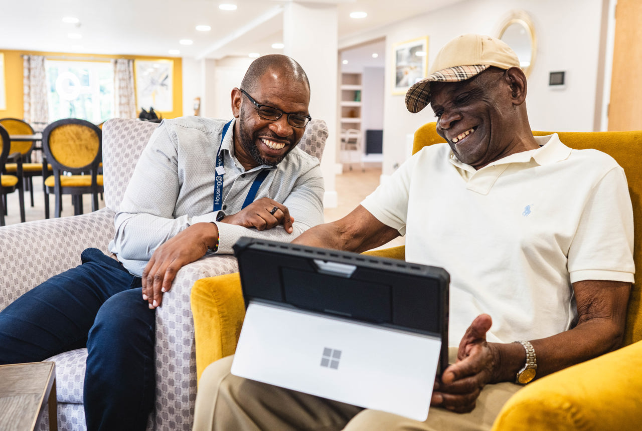 Residents and staff enjoying a moment together in the common area