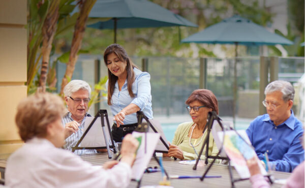Residents participating in an outdoor art class