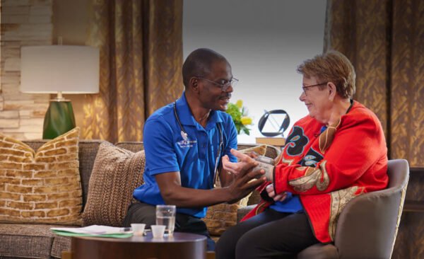 Staff member interacting with a resident in a common area