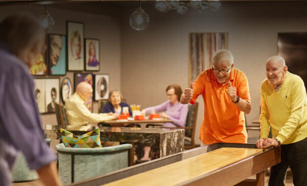 Residents enjoying a game in the common area