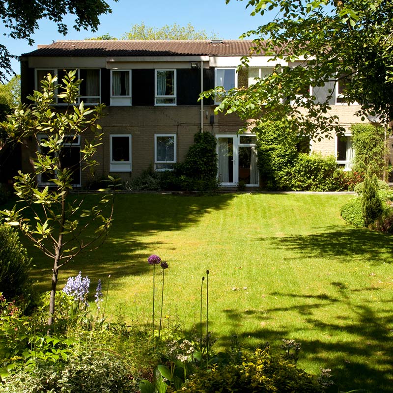 Well-maintained garden area in front of a building