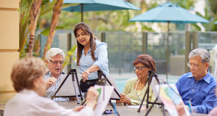 Residents participating in an art activity outdoors