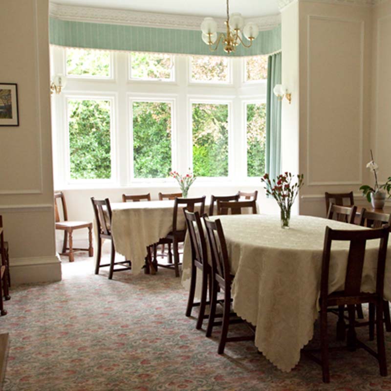 Dining area with tables and floral centerpieces