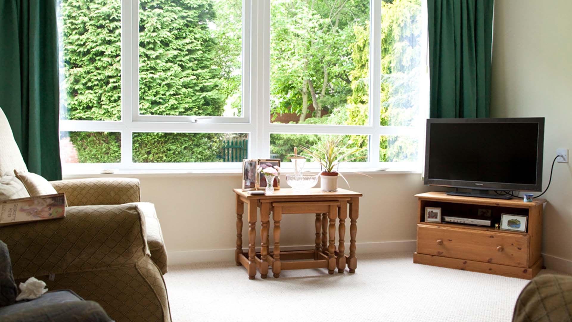 Interior living space with large windows and cozy furniture
