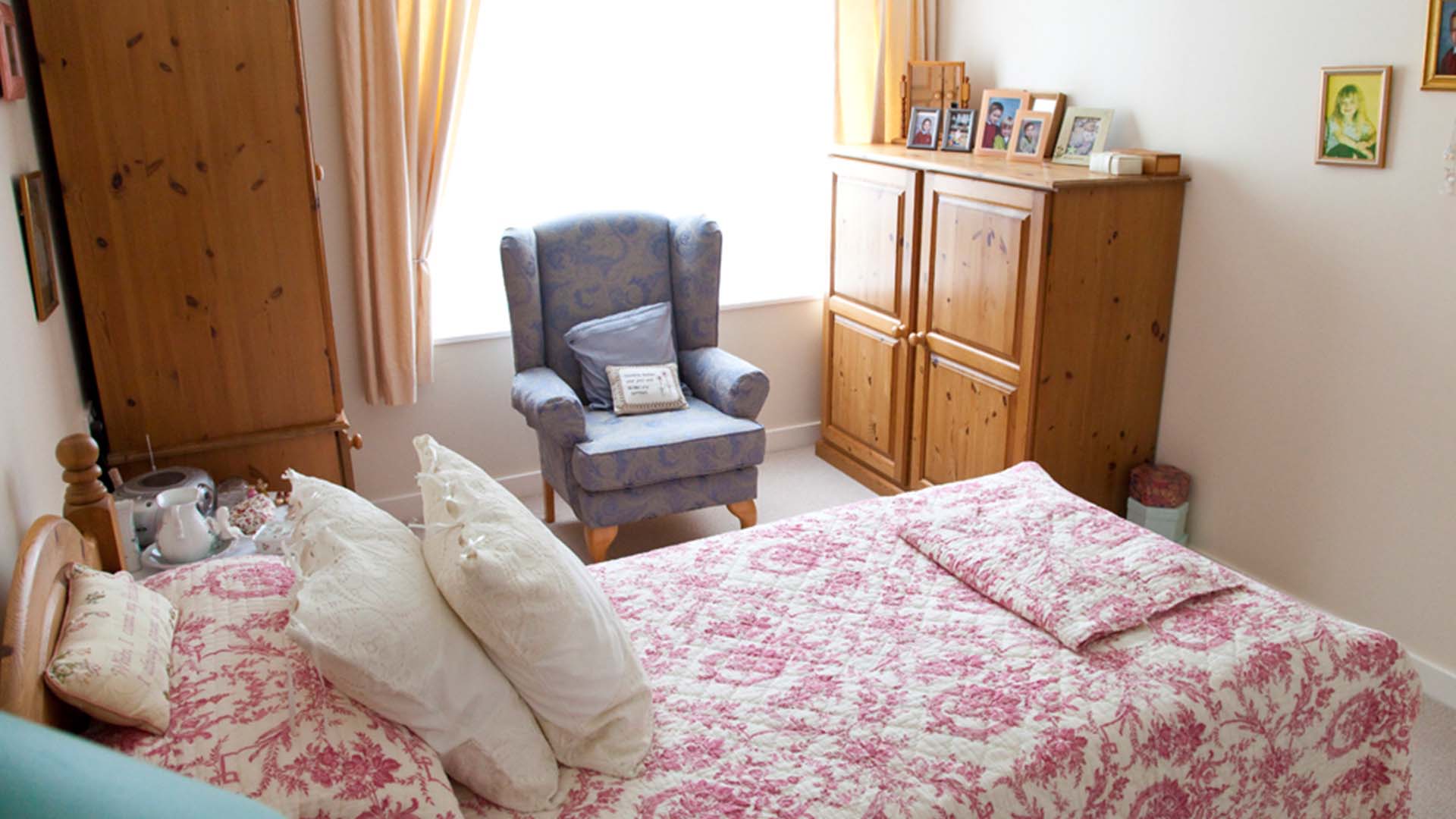 Cozy bedroom with personal touches and window light
