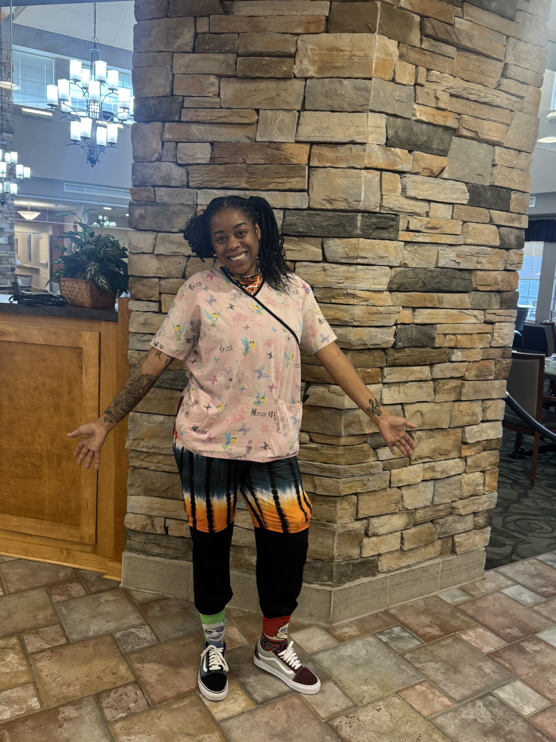 Staff member posing in a common area