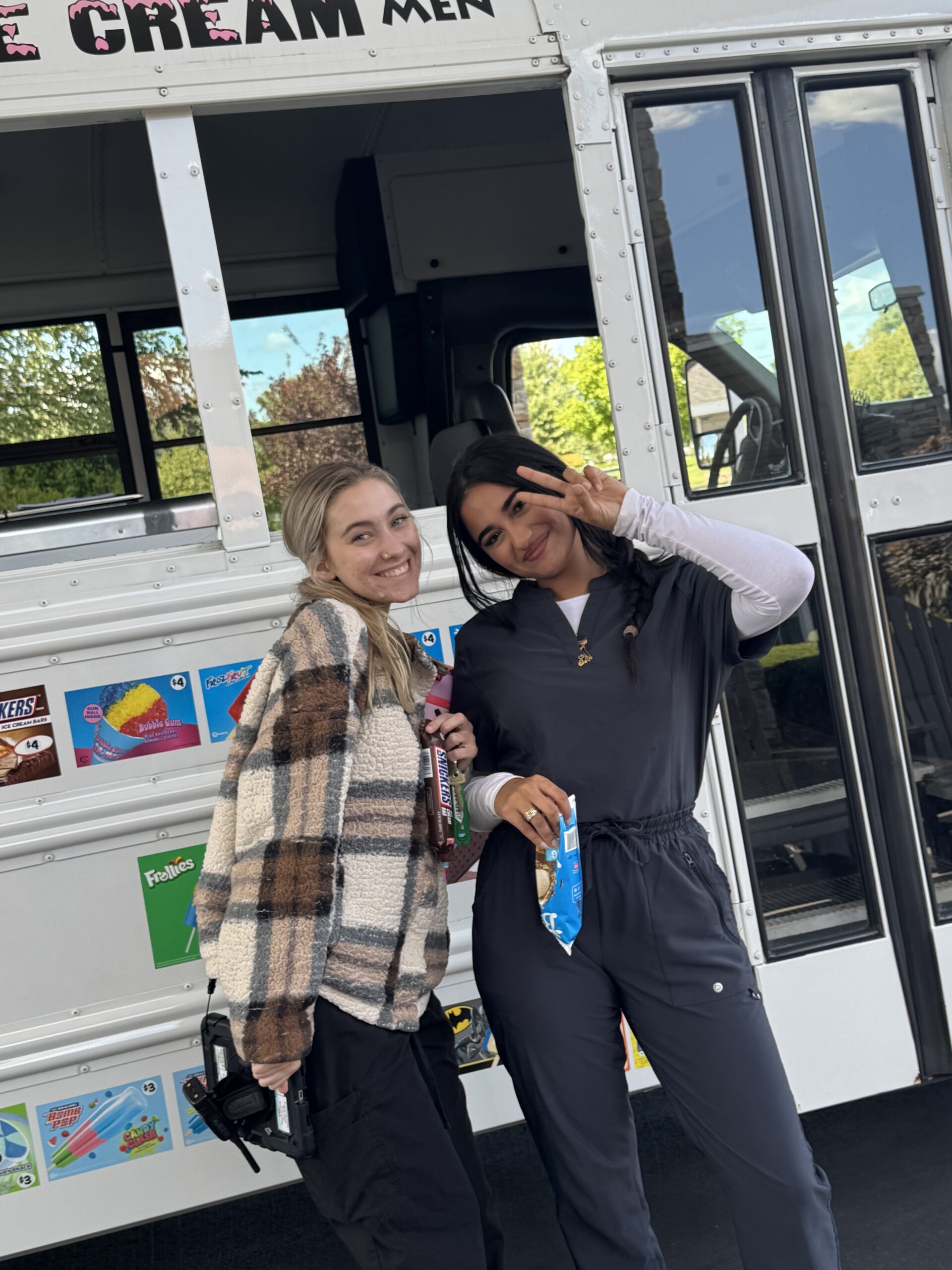 Two staff members enjoying an ice cream event