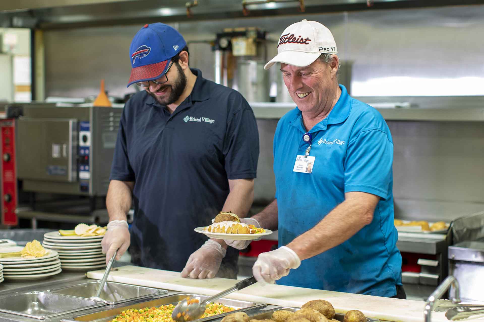 Staff serving food in the dining area