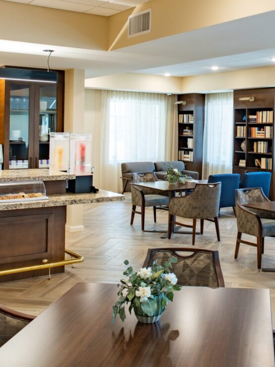 Cozy common area with seating and bookshelves