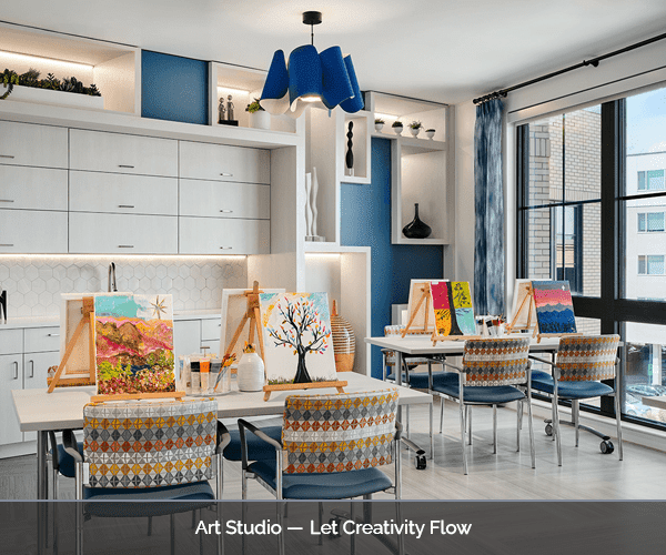 Bright art studio with resident paintings displayed