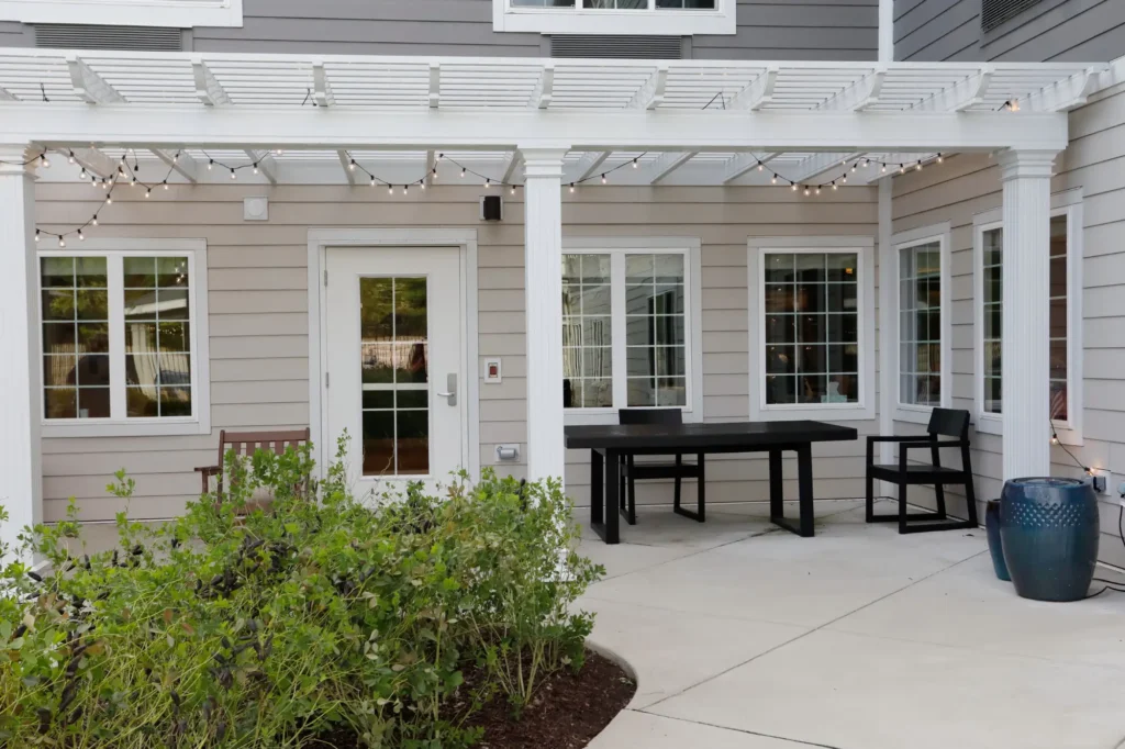 Outdoor seating area with garden and chairs