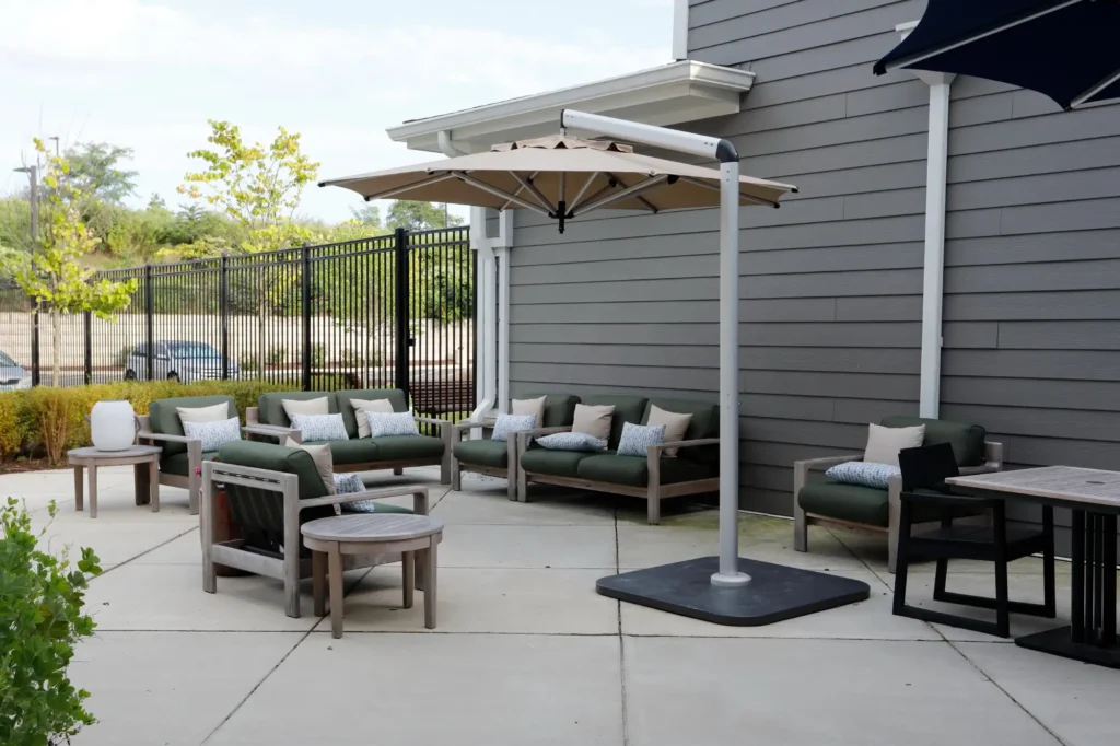 Outdoor seating area with umbrellas and lounge chairs