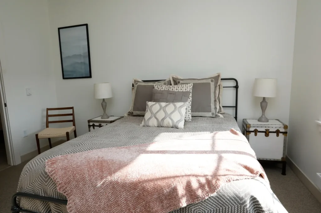 Cozy bedroom with a neatly made bed and decor