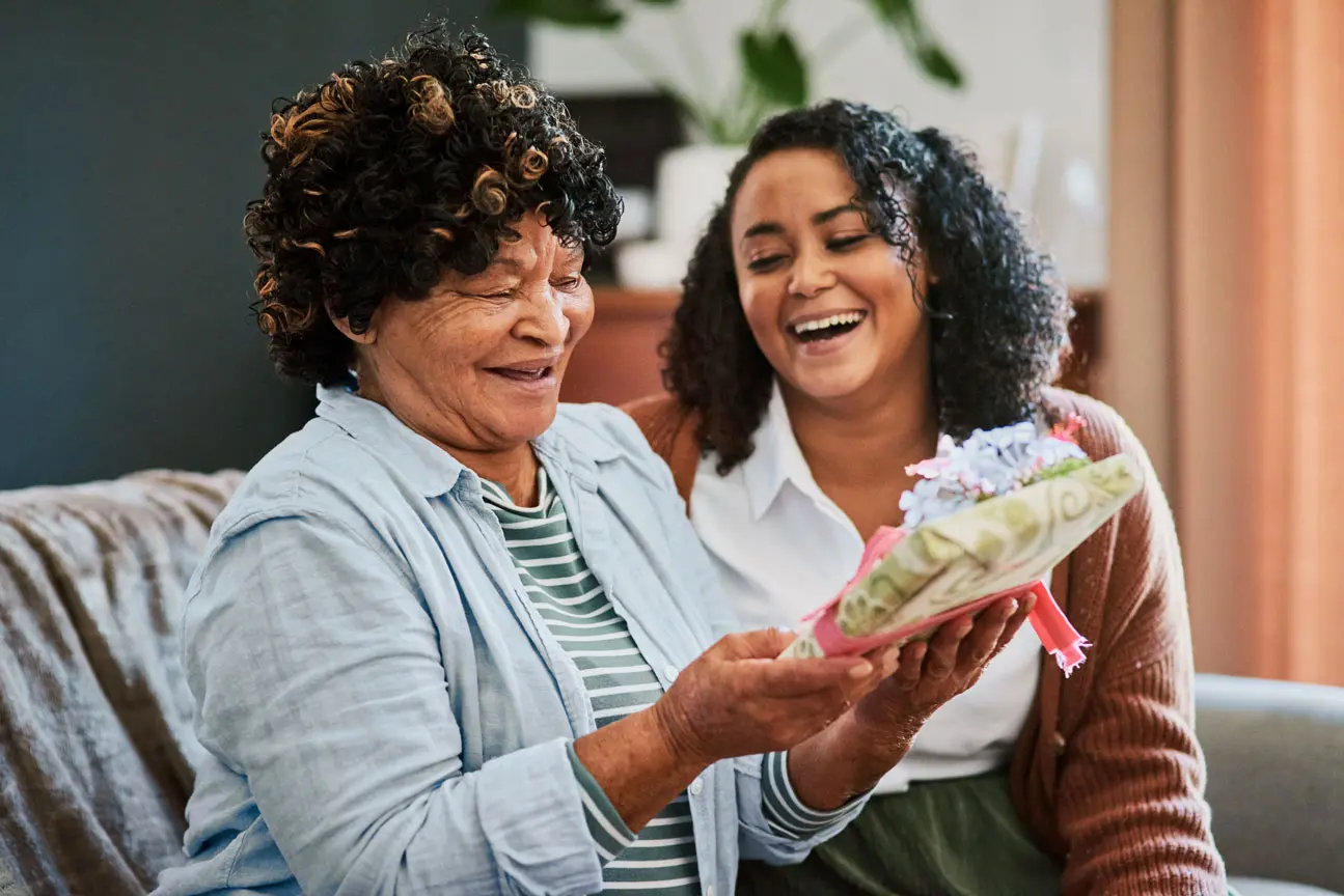 Two women enjoying a moment together indoors