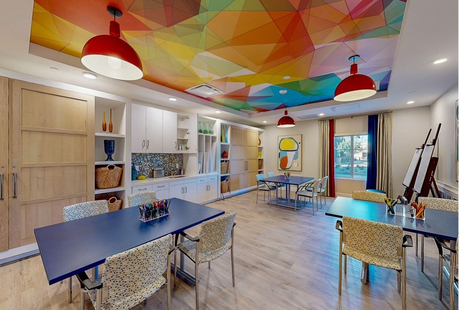 Bright activity room with colorful decor and tables