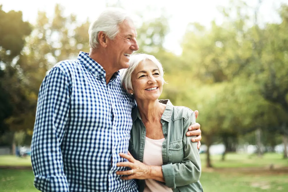 Happy couple enjoying a sunny day in a park