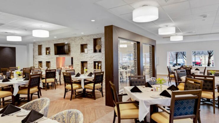 Bright dining room with tables set for meals