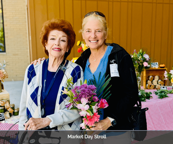 Residents enjoying an event with flowers