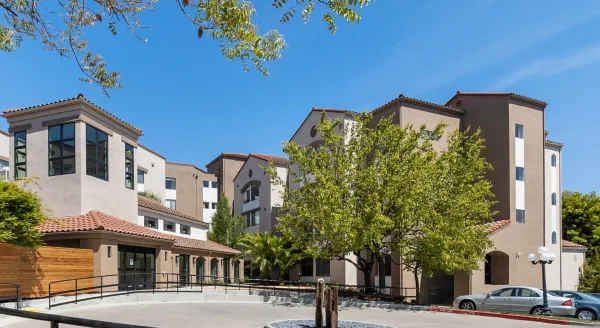 Exterior view of Cadence at Olney with vibrant landscaping