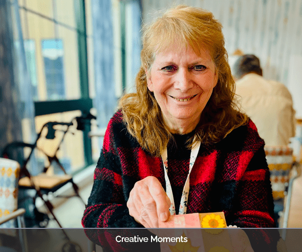 Resident engaging in a creative activity indoors