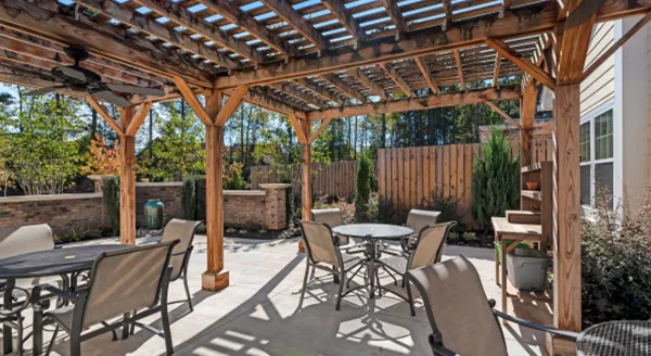 Outdoor patio area with tables and shade