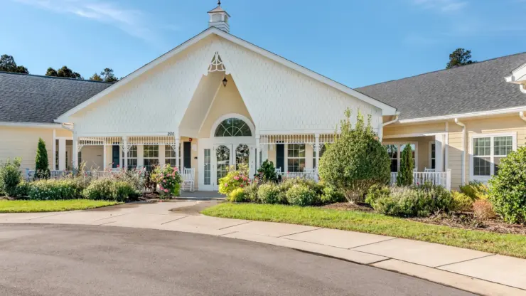 Front entrance of a senior living facility with landscaping
