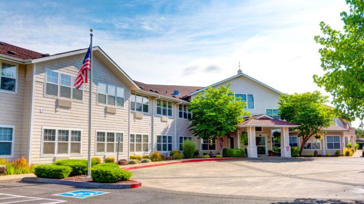 Exterior view of the assisted living facility with landscaping