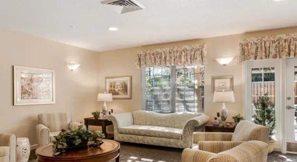 Bright common area with seating and soft lighting