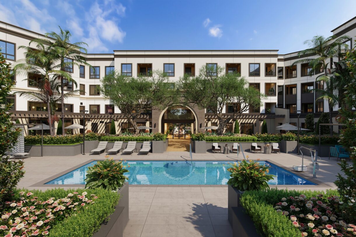 Outdoor pool area with palm trees and seating