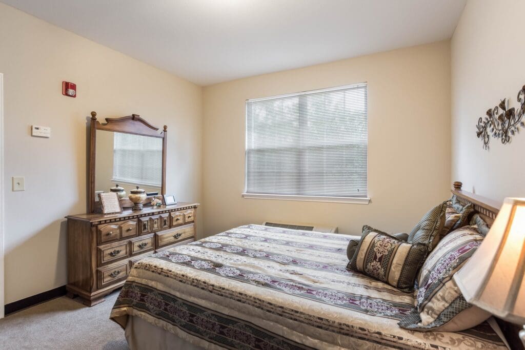 Cozy bedroom with a bed and dresser